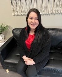 Leandra Hammer, dark-haired Behavioral Health Manager at Hickory Treatment Center, Rockville, showcasing professionalism and dedication in addiction recovery support